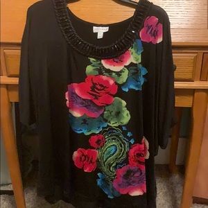 Black and floral blouse. With neck beading. 2x